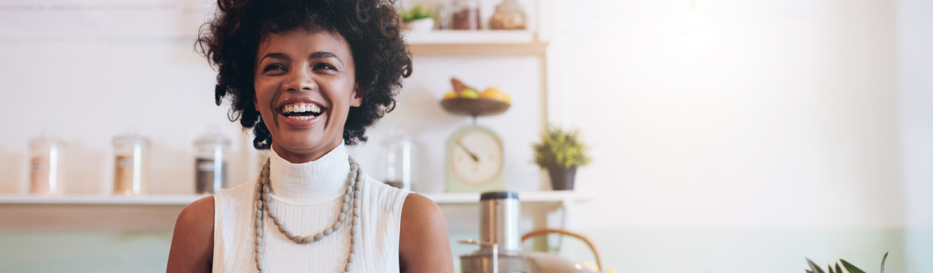 A young small business owner smiling