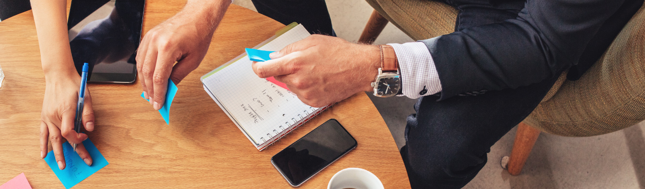 Two people working on a small business plan